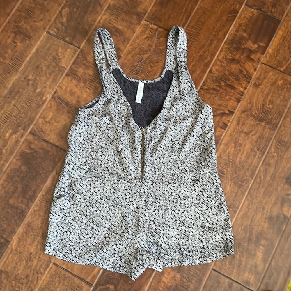 RVCA floral romper with zip front, adjustable straps, 2 front/back pockets